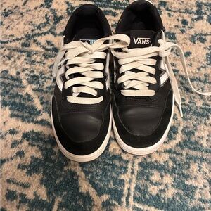 Vans women’s Black and White Lace-Up Sneakers